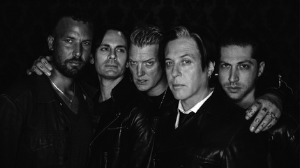 Promotional photograph of Queens of the Stone Age.