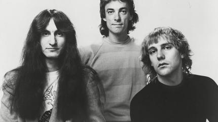 Promotional photograph of Rush.
