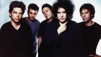 Promotional photograph of The Cure.