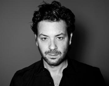 Promotional photograph of Adam Cohen.