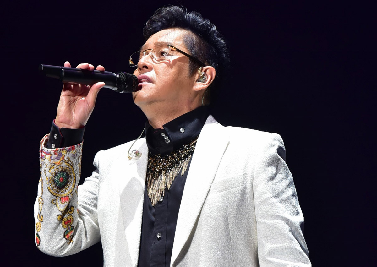 Promotional photograph of Alan Tam.