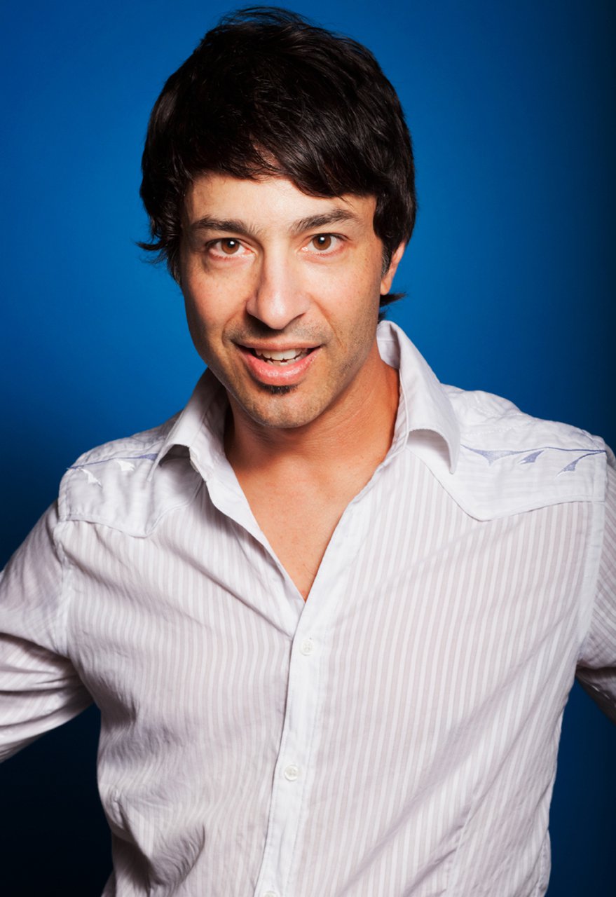 Promotional photograph of Arj Barker.