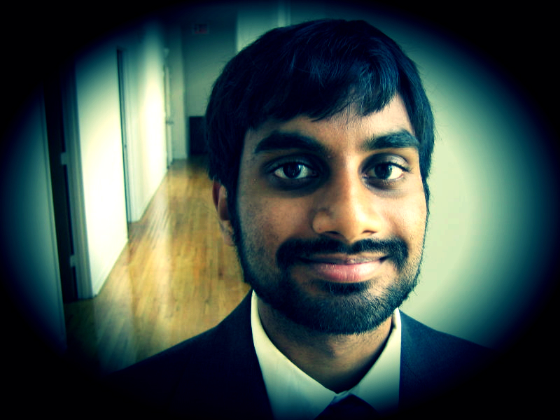 Promotional photograph of Aziz Ansari.