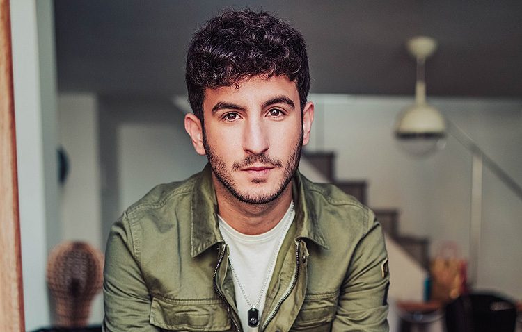 Promotional photograph of Carlos Torres.