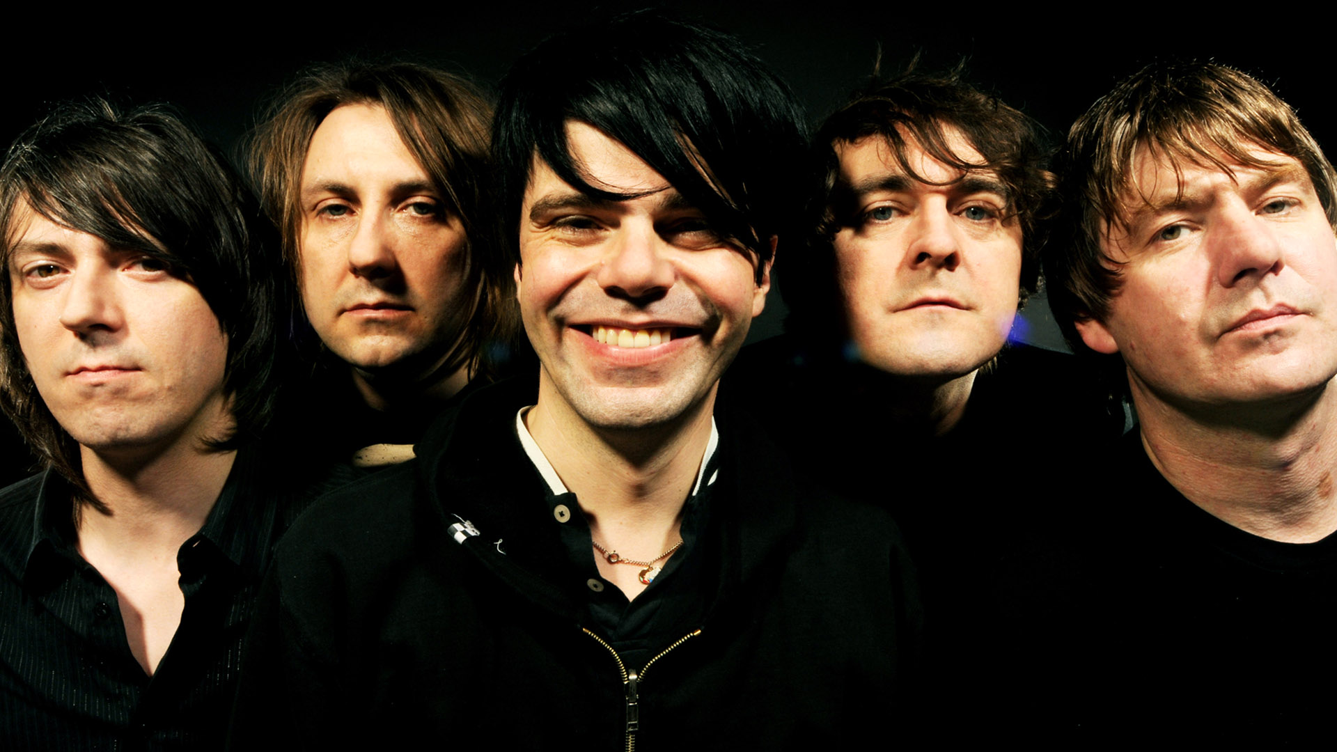 Promotional photograph of Charlatans UK.