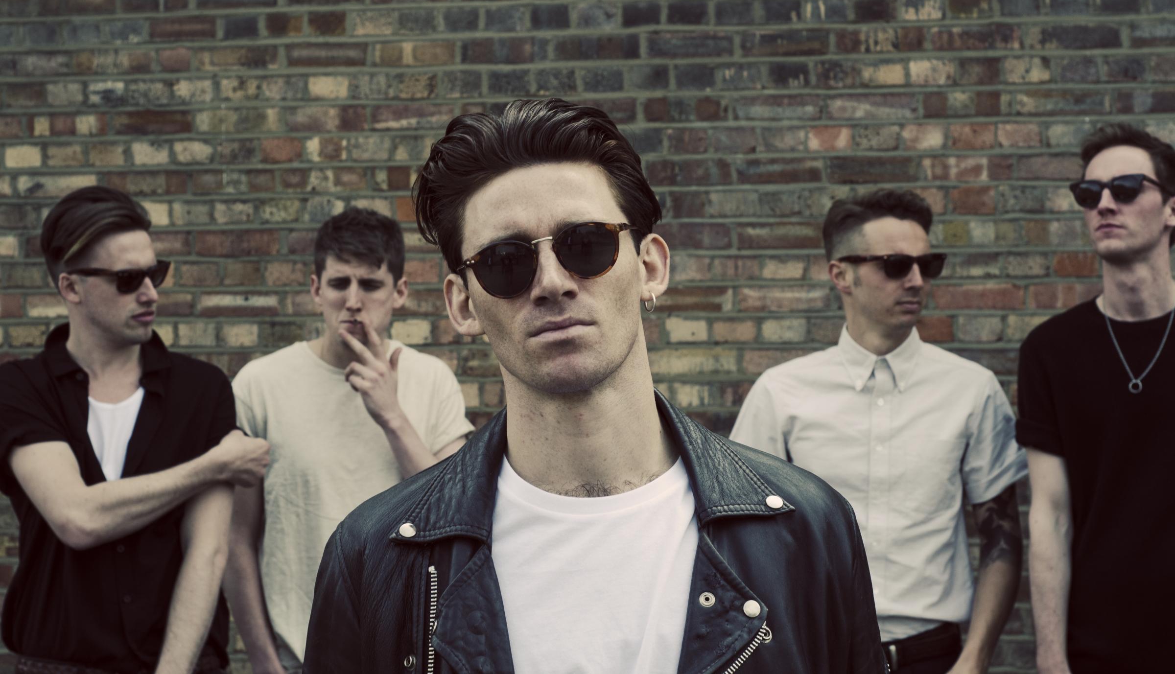 Promotional photograph of Coasts.