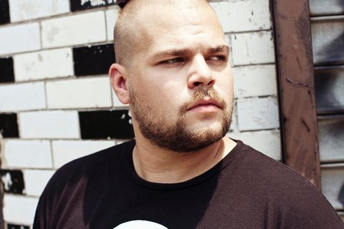 Promotional photograph of Com Truise.