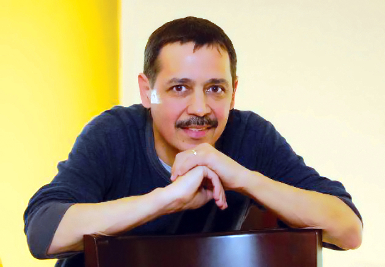Promotional photograph of Eddie Santiago.