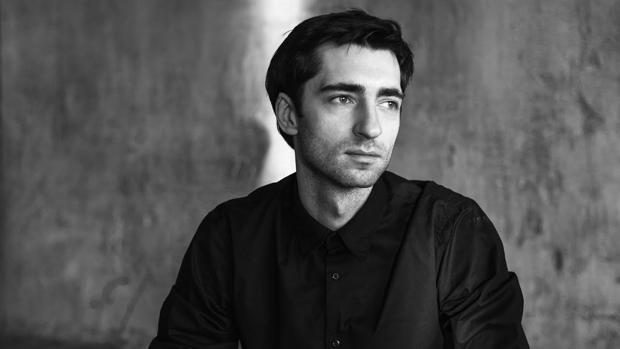 Promotional photograph of Evgeny Grinko.