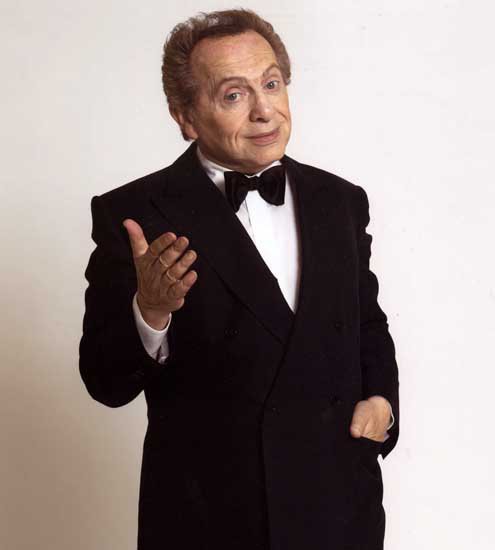 Promotional photograph of Jackie Mason.