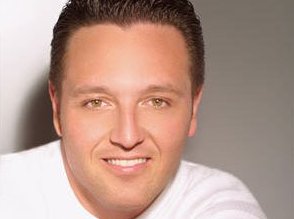 Promotional photograph of John Edward.