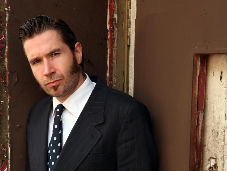 Promotional photograph of Justin Currie.