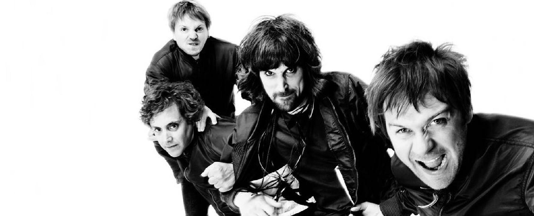 Promotional photograph of Kasabian.