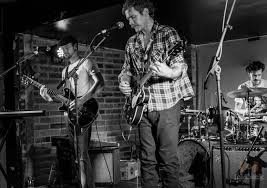 Promofoto von Concierto de Moving Targets en Cambridge.