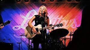Fotografia promocional de Paige Davis.