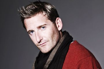 Promotional photograph of Paul Byrom.