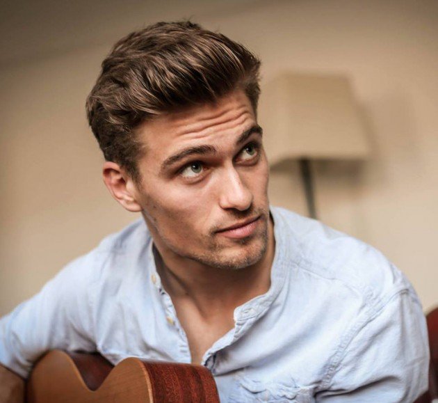 Promotional photograph of Rhys Lewis.