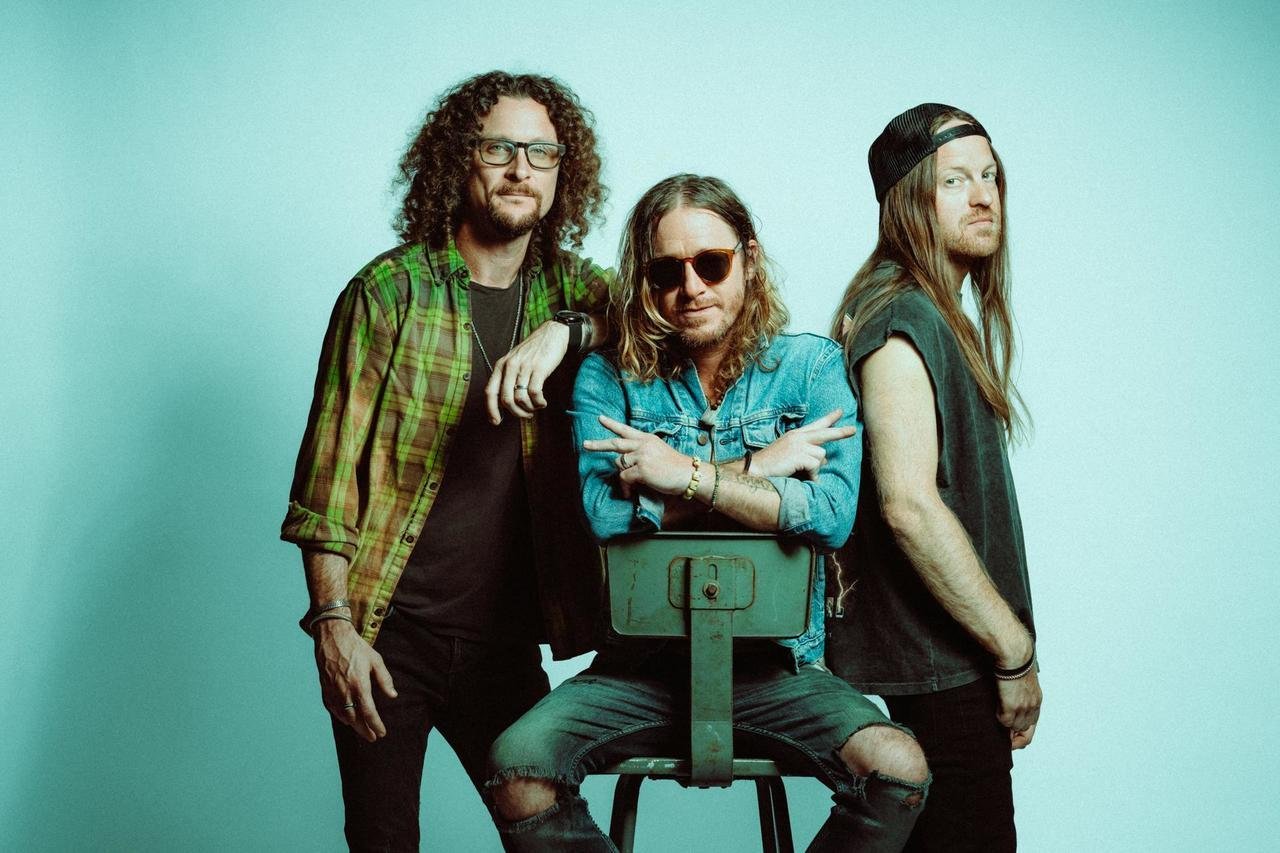 Promotional photograph of The Cadillac Three.
