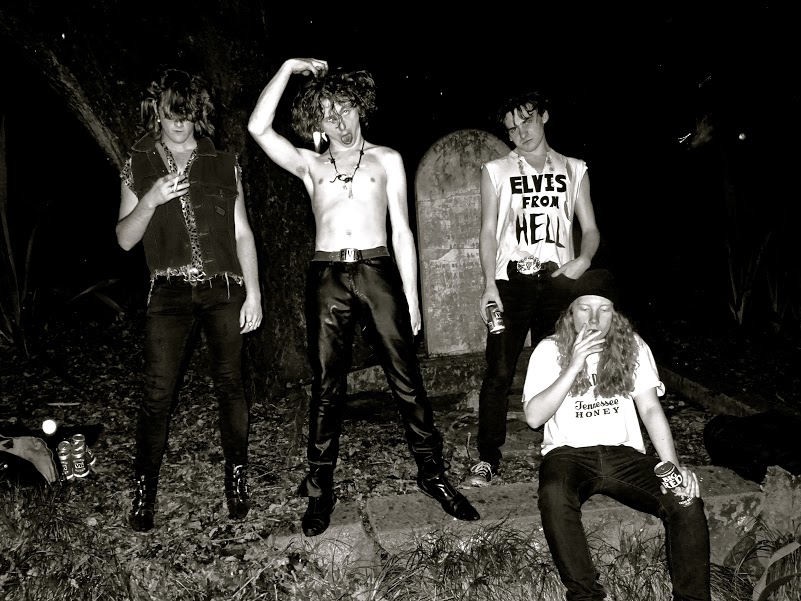 Promotional photograph of The Cavemen.