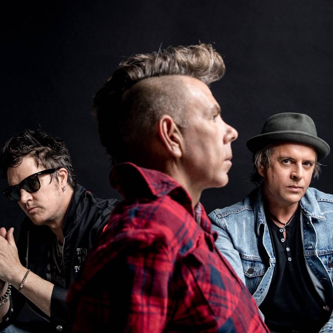 Promotional photograph of The Living End.